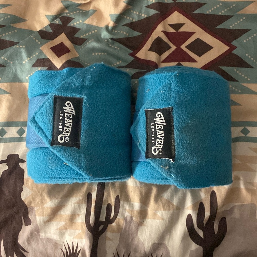 Two teal polo wraps